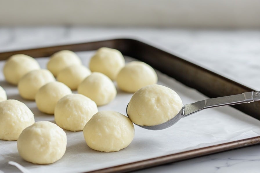 shaping keto air fryer donut holes with scoop